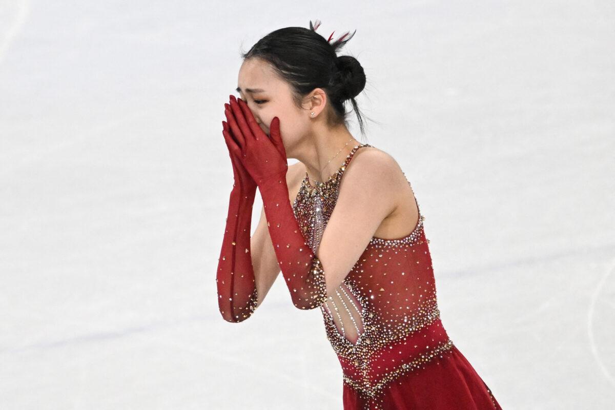 China's Zhu Yi reacts after competing in the women's single skating free skating of the figure skating team event during the Beijing 2022 Winter Olympic Games at the Capital Indoor Stadium in Beijing, on Feb. 7, 2022. (Anne-Christine Poujoulat/AFP via Getty Images)