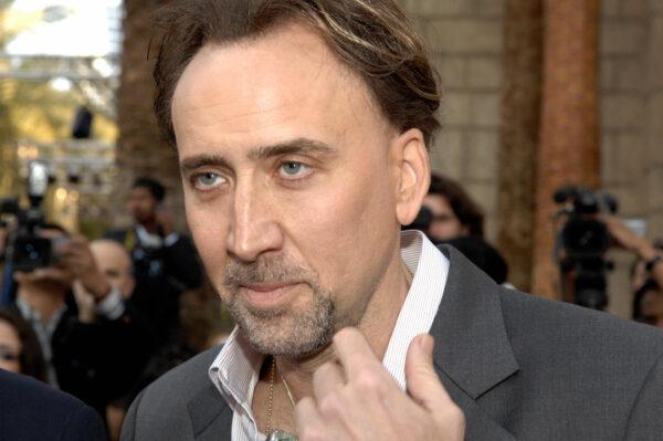 US actor Nicolas Cage speaks to the press as he arrives on the third day of the fifth edition of the Dubai International Film Festival on Dec. 13, 2008. (Houda Ibrahim/AFP via Getty Images)