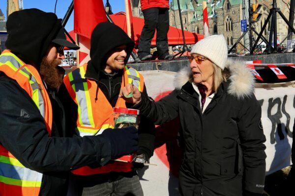 Protesters in Ottawa as demonstrations against COVID-19 mandates and restrictions continue, on Feb. 7, 2022. (Jonathan Ren/The Epoch Times)