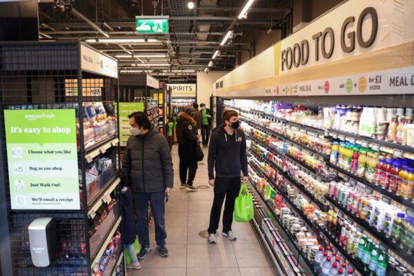 Customers shop at the UK's first Amazon Fresh supermarket in London on March 4, 2021. (Henry Nicholls/Reuters)