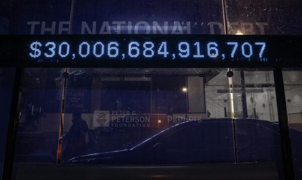  A Peterson Foundation billboard displaying the national debt is pictured on K Street in downtown Washington, on Feb. 8, 2022. (Jemal Countess/Getty Images for Peter G. Peterson Foundation)