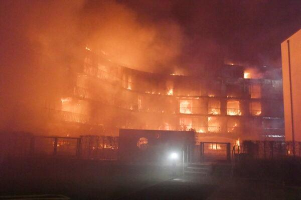 A residential complex in flames in Essen Germany, on Feb. 21, 2022. (Stephan Witte/KDF-TV/dpa via AP)