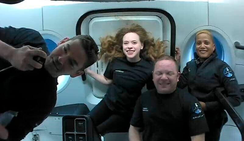 (L-R) Jared Isaacman, Hayley Arceneaux, Chris Sembroski, and Sian Proctor, passengers of Inspiration4 in the Dragon capsule on their first day in space in September 2021. (SpaceX via AP)