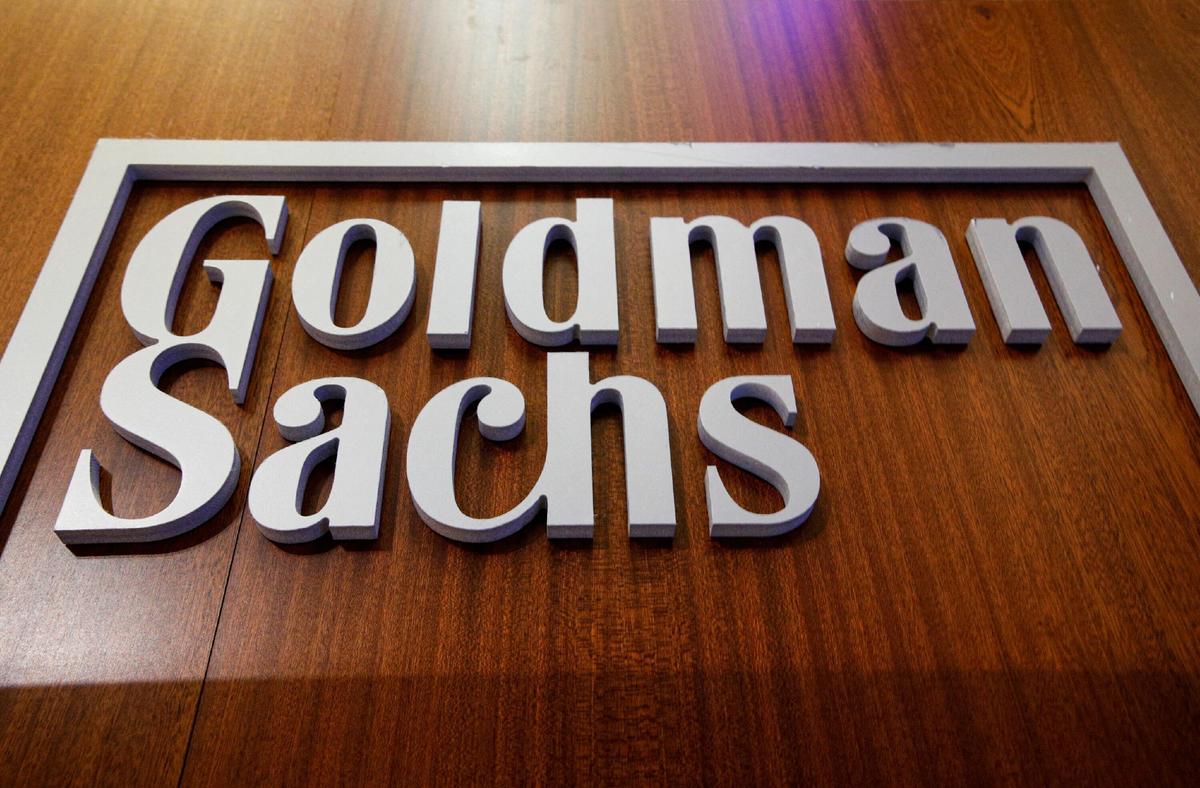 Goldman Sachs Profit Nearly Halves on Slowdown in Dealmaking