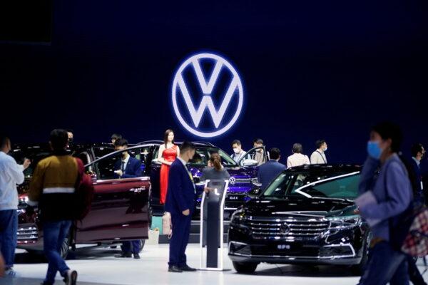 People visit the Volkswagen booth during a media day for the Auto Shanghai show on April 19, 2021. (Aly Song/Reuters)