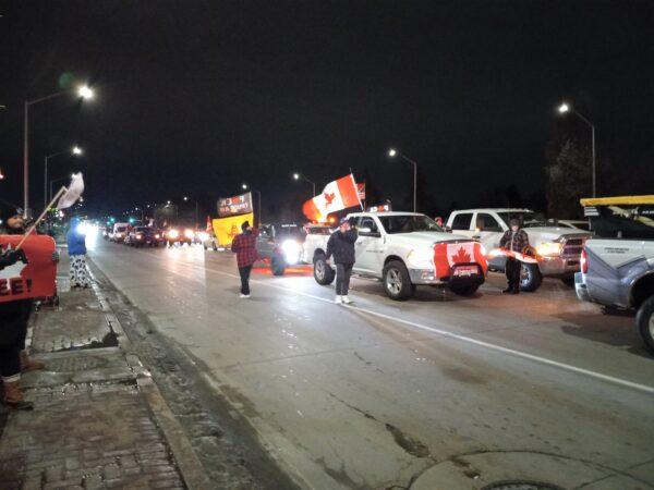 Vehicles take part in a protest blockade by the Ambassador Bridge in Windsor, Ontario, on Feb. 9, 2022. (Lisa Lin/The Epoch Times)