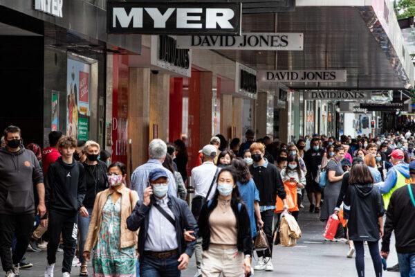 People walk along Bourke Street Mall during the Boxing Day sales in Melbourne, Australia, on Dec. 26, 2021. (Diego Fedele/Getty Images)