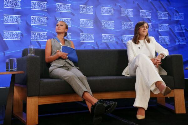 Former Australian of the year, Grace Tame (L) and Brittany Higgins, advocates for survivors of sexual assault, address the media at the National Press Club in Canberra, Australia, on Feb. 9, 2022. (Lisa Maree Williams/Getty Images)
