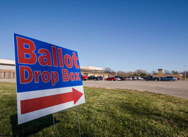A sign pointing in the direction of a ballot drop box at the Schmidt Community Center polling station in Lansing, Mich., on Nov. 3, 2020. (Seth Herald/AFP via Getty Images)