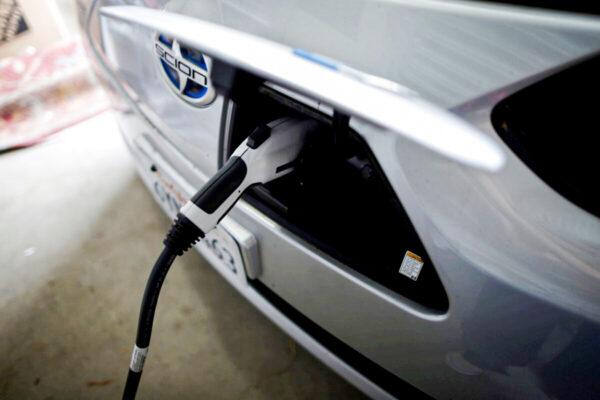 An electric car is plugged in in Irvine, Calif., on Jan. 26, 2015. (Lucy Nicholson/Reuters)