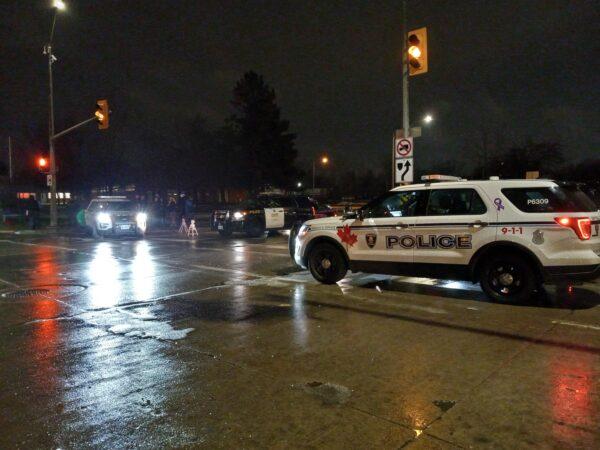Police vehicles by the protest site at the Ambassador Bridge in Windsor, Ont., on Feb. 11, 2022. (Lisa Lin/The Epoch Times)