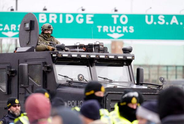 Ontario Provincial Police in an armoured vehicle at the Ambassador Bridge in Windsor on Feb. 12, 2022. (Geoff Robins/AFP via Getty Images)