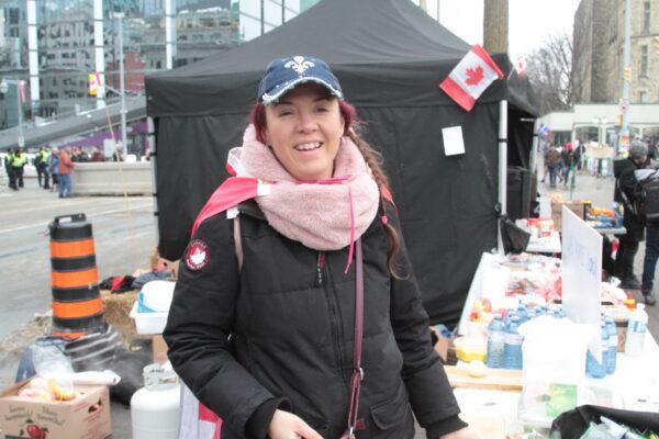 Marie Eye of Quebec is happy preparing soup for whoever wants it during the protest, in Ottawa, Canada, on Feb. 11, 2022. (Richard Moore/The Epoch Times)