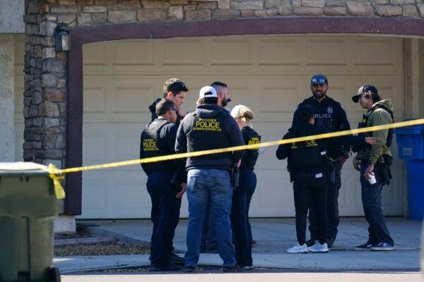 A large police presence is seen near a house where several Phoenix Police Department officers were shot and four others were injured after responding to a shooting inside the home, in Phoenix, on Feb. 11, 2022. (Ross D. Franklin/AP Photo)