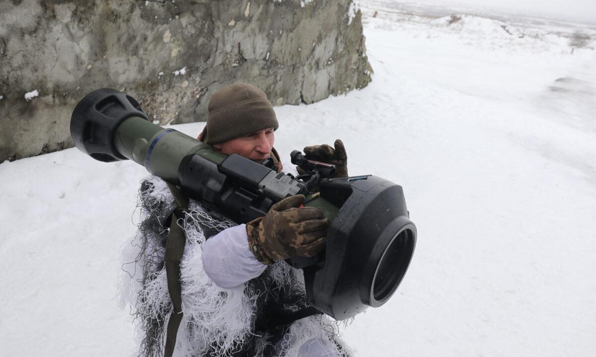 A Ukrainian Military Forces serviceman aims with a Next generation Light Anti-tank Weapon (NLAW) Swedish-British anti-aircraft missile launcher during a drill at the firing ground of the International Center for Peacekeeping and Security, near the western Ukrainian city of Lviv on Jan. 28, 2022. (AFP via Getty Images)