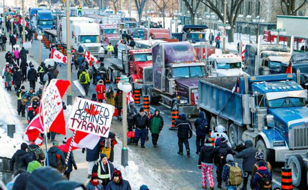 Trucks are parked on Wellington Street near the Parliament Buildings as truckers and supporters protest against COVID-19 mandates in Ottawa on Jan. 29, 2022. (Patrick Doyle/Reuters)