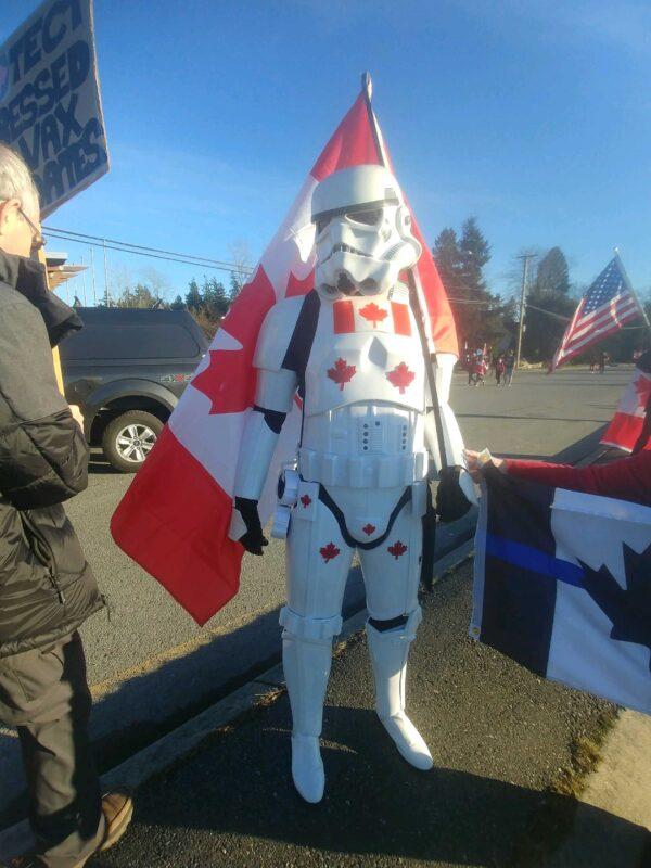 A protester demonstrates against COVID-19 mandates at the Canada-U.S. border by the Pacific Highway in Surrey, B.C., on Feb. 12, 2022. (Jeff Sandes/The Epoch Times)