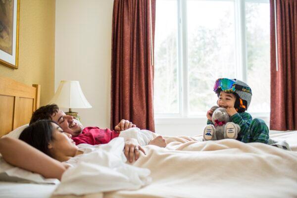 A young child is excited to get out on the hill as the parents snooze in their condo. (Nick Anastasi/Smugglers' Notch Resort)