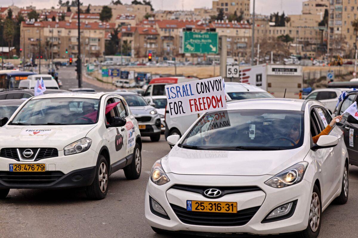 Israeli vehicles take part in a Canada-style protest convoy against COVID-19 regulations in Jerusalem on Feb. 14, 2022. (Ronaldo Schemidt/AFP via Getty Images)