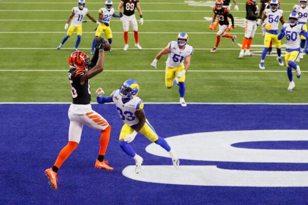 Tee Higgins #85 catches a touchdown pass from Joe Mixon #28 of the Cincinnati Bengals over Nick Scott #33 of the Los Angeles Rams during the second quarter of Super Bowl LVI at SoFi Stadium, in Inglewood, Calif., on February 13, 2022. (Steph Chambers/Getty Images)