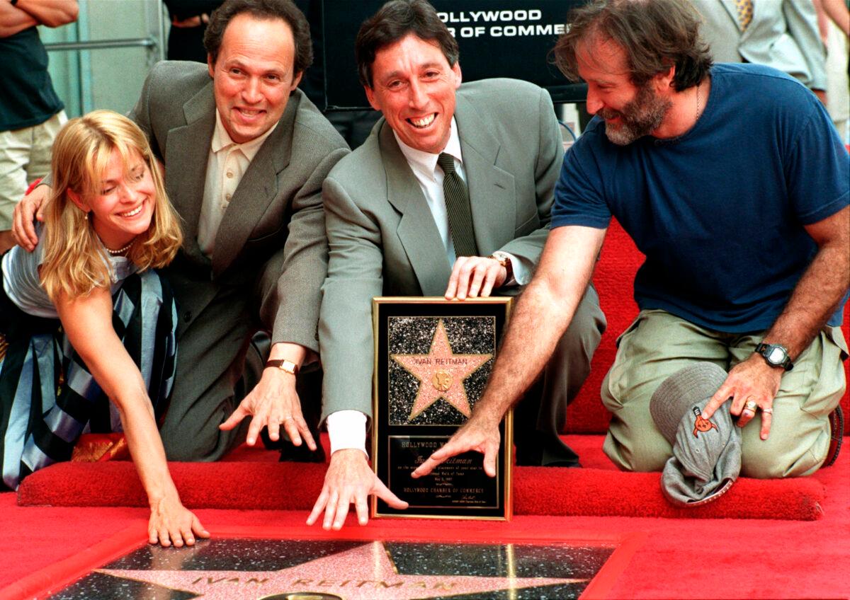 Producer and director Ivan Reitman, center, is honored with a star on the Hollywood Walk of Fame, on the Hollywood Boulevard in the Hollywood section of Los Angeles, Calif., on May 5, 1997. (Damian Dovarganes/AP Photo)