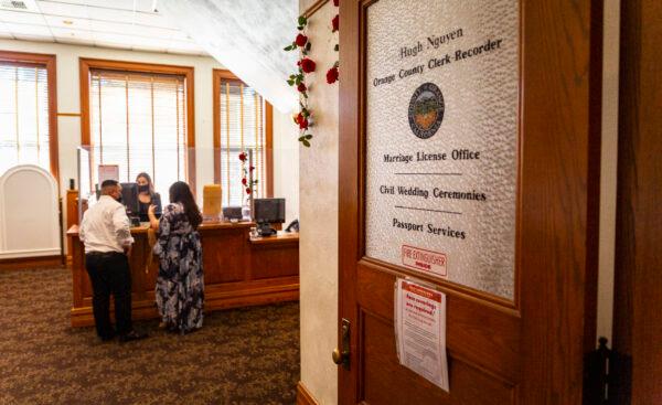 Couples arrange for wedding services at the Old Orange County Courthouse in Santa Ana, Calif., on Feb. 14, 2022. (John Fredricks/The Epoch Times)