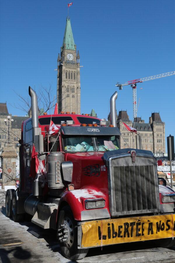A truck sits in the main protest area on Wellington St, Ottawa, on Feb. 14, 2022. (Richard Moore/The Epoch Times)
