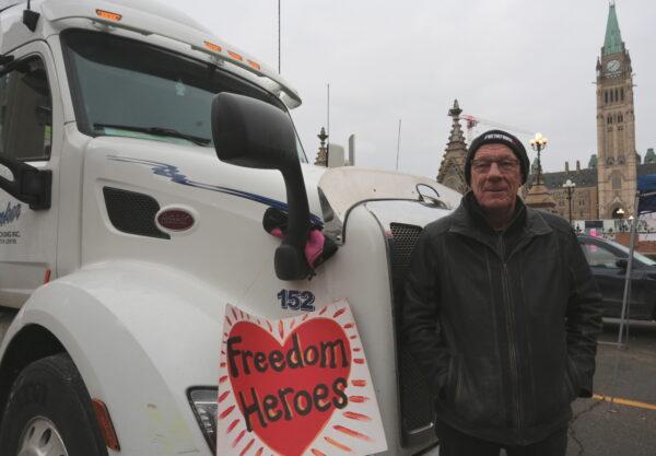 Trucker Bill Dykema, from Grimsby, Ontario, was one of the first protesters to park his rig in the center of Ottawa. He says he is taking action for his 19 grandchildren. (Richard Moore/The Epoch Times)