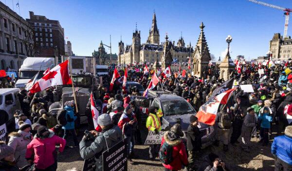  Protesters stand on the back of a truck during the Freedom Convoy demonstrations against COVID-19 vaccine mandates and other restrictions on Parliament Hill in Ottawa on Jan. 29, 2022. (Adrian Wyld/The Canadian Press)