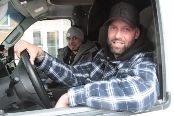Eric (R) and Patrick, truck drivers from Montreal, say they are at the Ottawa protest until the end. Eric says he is fighting for his rights and those of his children. Photo taken on Feb. 13, 2022. (Richard Moore/The Epoch Times)