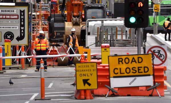 Construction workers are pictured at a building site in Melbourne's city centre in Australia, on Sep. 17, 2020. (William West/AFP via Getty Images)