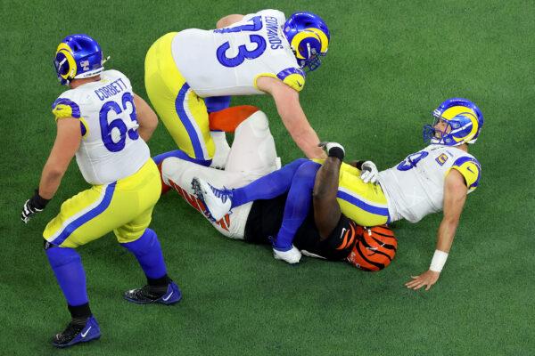 Matthew Stafford #9 of the Los Angeles Rams is sacked by D.J. Reader #98 of the Cincinnati Bengals during Super Bowl LVI at SoFi Stadium in Inglewood, Calif., on Feb. 13, 2022. (Gregory Shamus/Getty Images)