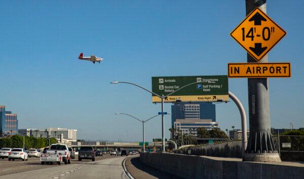 A single engine private airplane fly in for landing at John Wayne Airport in Santa Ana, Calif., on Feb. 14, 2022. (John Fredricks/The Epoch Times)