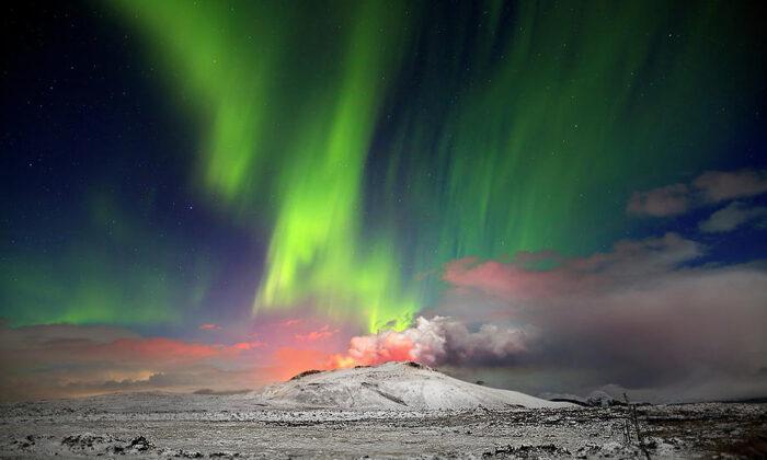 American Expat Photographer Captures Epic Scene of Northern Lights Behind Erupting Volcano in Iceland