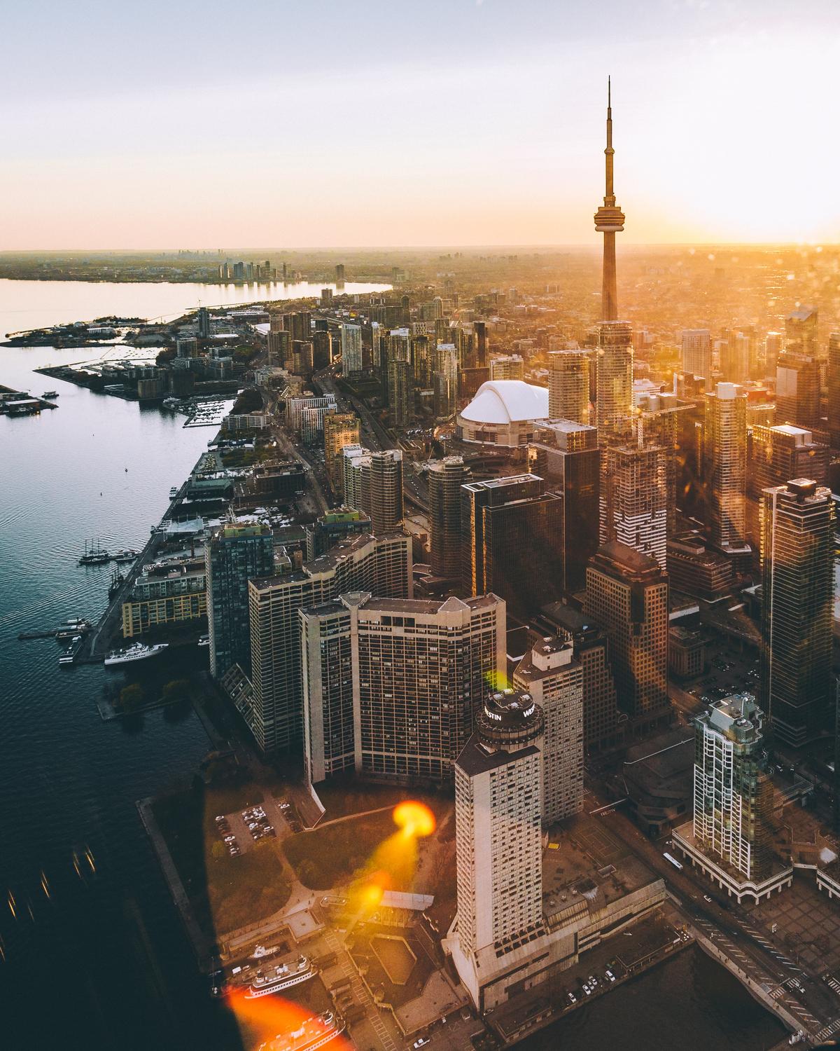 Downtown Toronto, as seen from the air on a helicopter tour, at sunset. (mwangi gatheca/Unsplash)