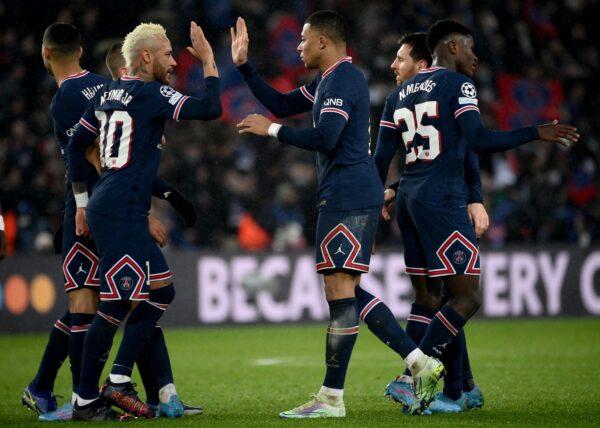 Paris Saint-Germain's Brazilian forward Neymar (L) and Paris Saint-Germain's French forward Kylian Mbappe (R) celebrate after winning the UEFA Champions League round of 16 first leg football match between Paris Saint-Germain (PSG) and Real Madrid at the Parc des Princes stadium, in Paris, on Feb. 15, 2022. (Frank Fife/Getty Images)