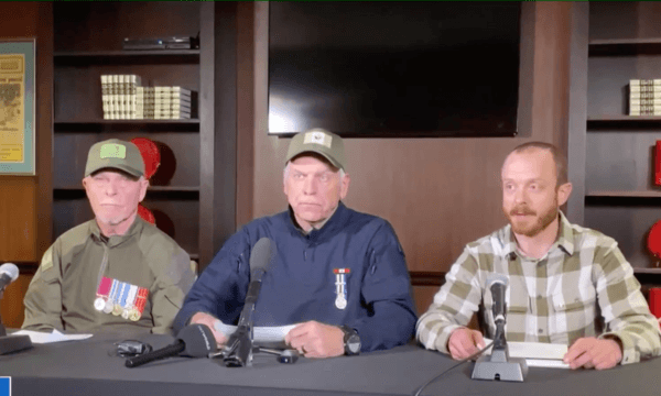 (L–R) Military veteran Eddie Cornell, former Ontario Provincial Police officer Vincent Gircys, and former RCMP officer Daniel Bulford hold a press conference organized by Freedom Convoy in Ottawa on Feb. 16, 2022. (NTD)