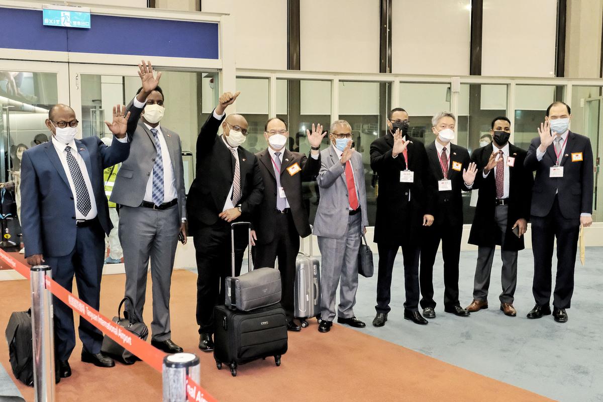 Somaliland's Foreign Minister Essa Kayd (3rd L) waving with his delegation after arriving at Taoyuan International Airport outside Taipei on Feb. 8. (STR/CNA/AFP via Getty Images)