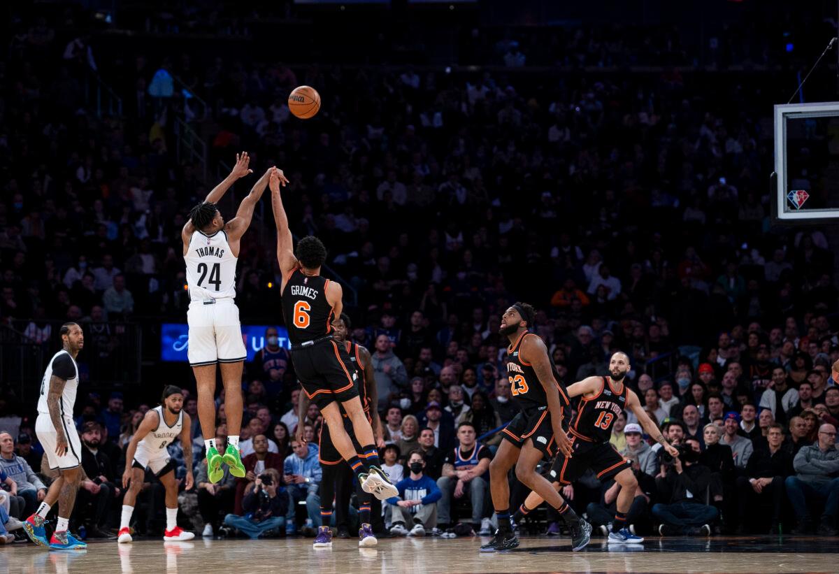 Cam Thomas #24 of Brooklyn Nets makes a three against Quentin Grimes #6 of the New York Knicks at Madison Square Garden, in New York City, on Feb. 16, 2022. (Michelle Farsi/Getty Images)