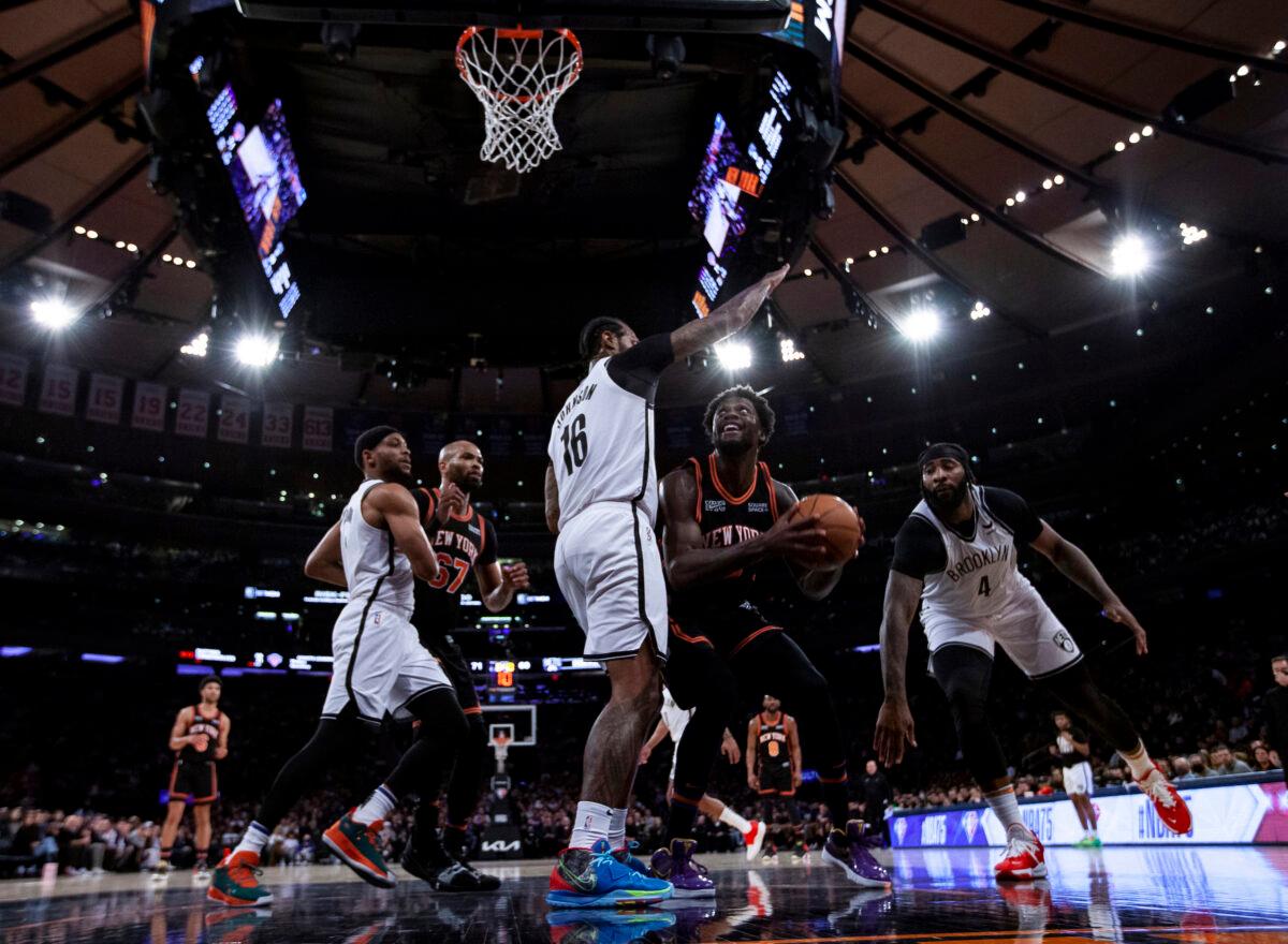 James Johnson #16 of the Brooklyn Nets blocks the basket against Julius Randle #30 of the New York Knicks at Madison Square Garden, in New York City, on Feb. 16, 2022. (Michelle Farsi/Getty Images)