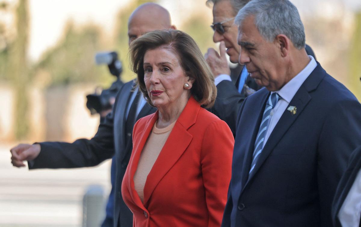 U.S. House Speaker Nancy Pelosi (D-Calif.) walks alongside Israeli Knesset Speaker Mickey Levy (R) during a welcome ceremony at the Knesset (Israeli Parliament) in Jerusalem on Feb. 16, 2022. (Menahem Kahana/AFP via Getty Images)