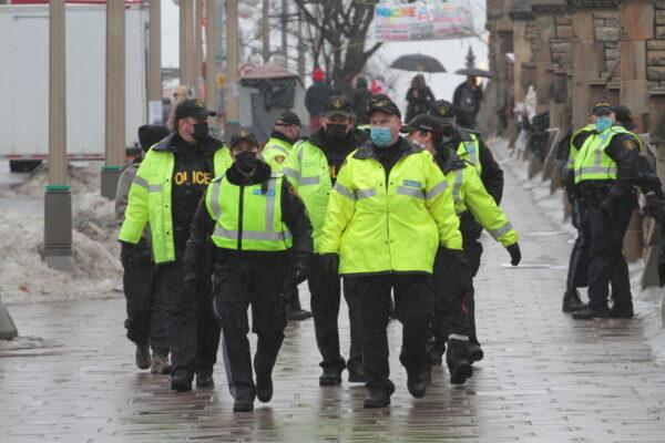  Larger police patrols were noticeable in the blockaded area of Ottawa on Feb. 17. (Richard Moore/The Epoch Times)