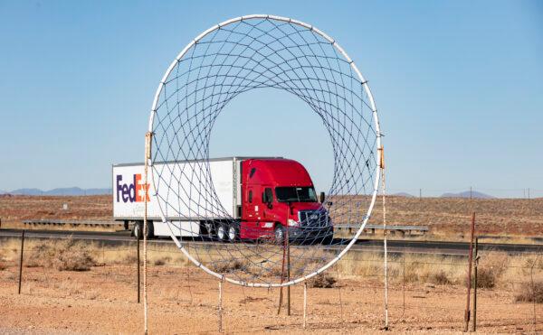 Semi-trailer trucks pass through the state of Arizona on Dec. 3, 2021. (John Fredricks/Epoch Times)