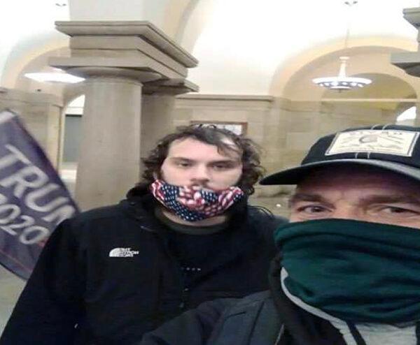 Brian E. Stenz, in the green mask, inside the U.S. Capitol on Jan. 6, 2021. (U.S. Department of Justice)