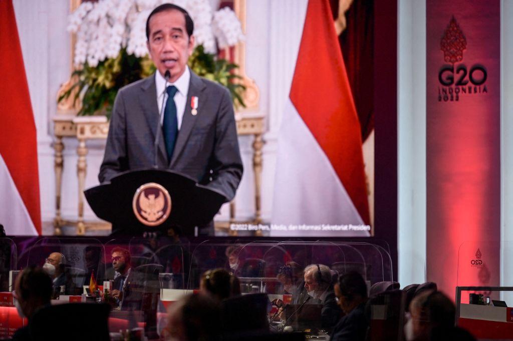 Indonesian President Joko Widodo (on screen) delivers opening remarks at the opening of the G20 finance ministers meeting in Jakarta, Indonesia, on Feb. 17, 2022. (Bay Ismoyo/AFP/Getty Images)
