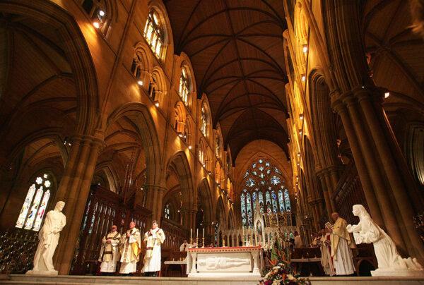 Bishop Julian Porteous (2L) leads the congregation in prayer during celebrations to mark the canonisation of Mary MacKillop at St. Mary's Cathedral in Sydney, Australia, on Oct. 17, 2010. (Sergio Dionisio/Getty Images)