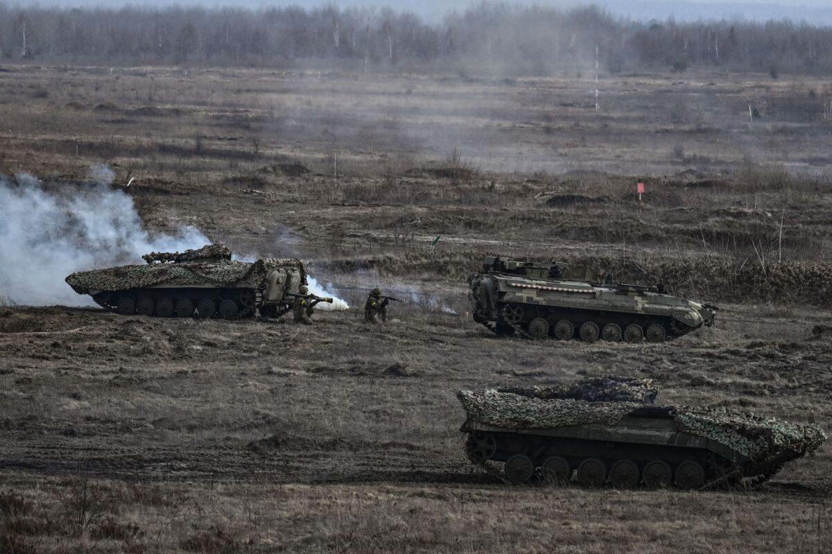 Ukrainian troops take part in a military drill outside the city of Rivne, Ukraine, on Feb. 16, 2022. (Aris Messinis / AFP)