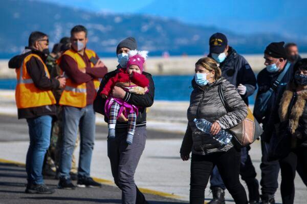 Passengers arrive at the port of Corfu island, northwestern Greece, after being evacuated from a ferry, on Feb.18, 2022. (Stamatis Katopodis/InTime News via AP)