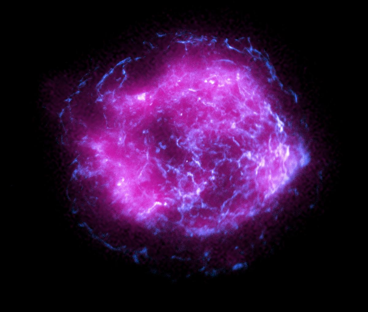 A newly released image of supernova remnant Cassiopeia A combines some of the first X-ray data collected by NASA’s IXPE, shown in magenta, with high-energy X-ray data from NASA’s Chandra X-Ray Observatory, in blue. (<a href="https://www.nasa.gov/sites/default/files/thumbnails/image/chandra_ixpe_v3magentahires.jpg">NASA/CXC/SAO/IXPE</a>)