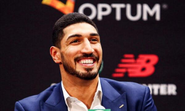 Enes Kanter Freedom reacts during a press conference as he's introduced as a member of the Boston Celtics at the Auerbach Center at New Balance World Headquarters in Boston on July 17, 2019. (Tim Bradbury/Getty Images)